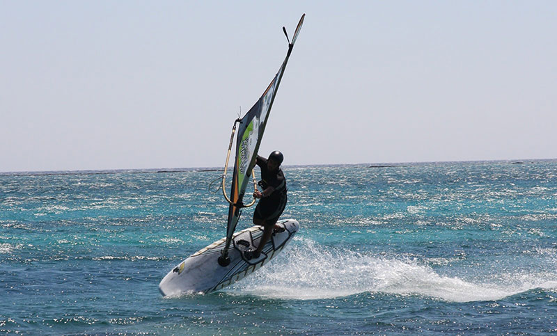 Wind surfing in the pink blue waters of Elafonisi beach